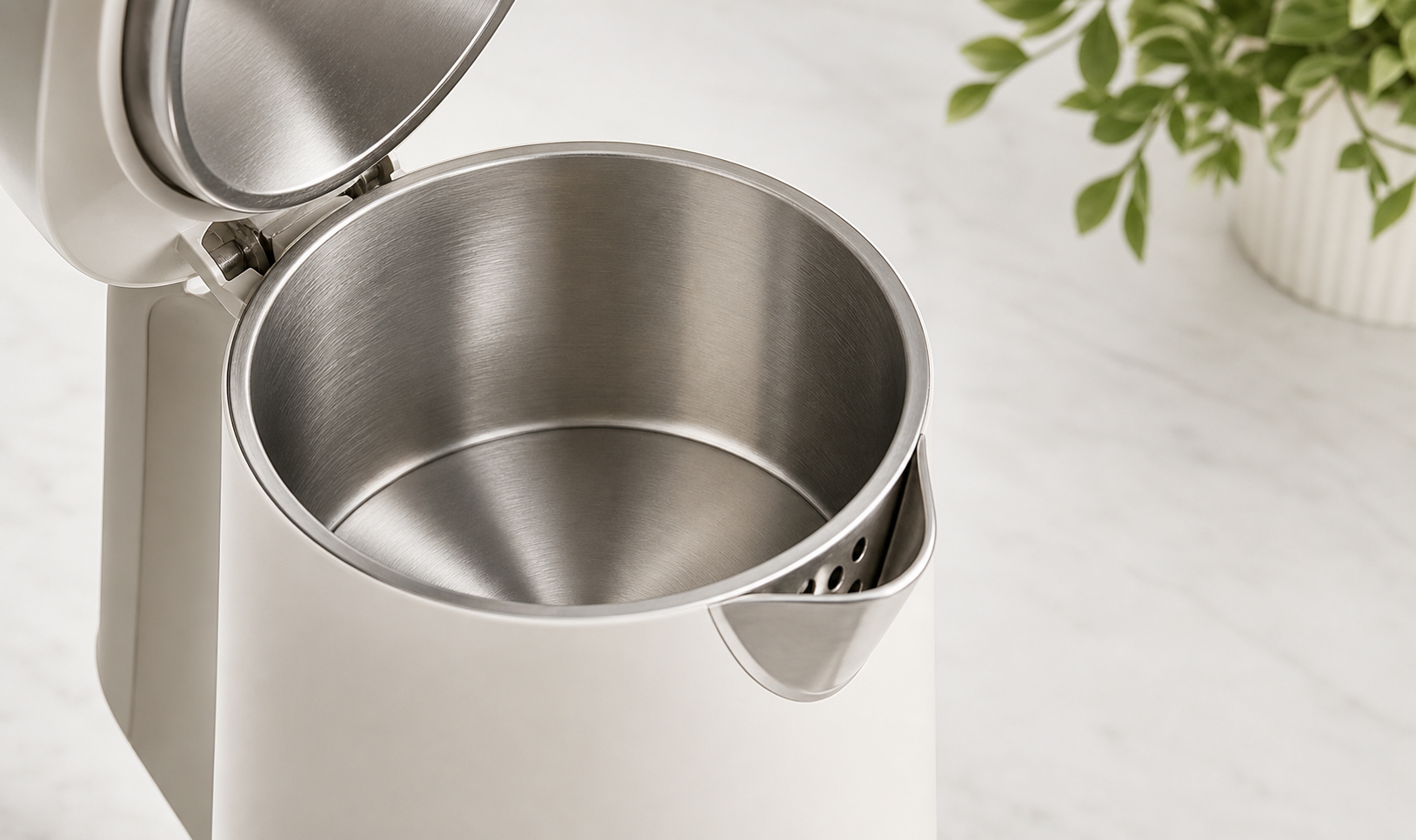 Close-up of the stainless steel interior of a portable electric kettle.